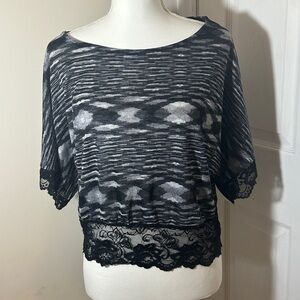 No Boundaries black and white knit top.